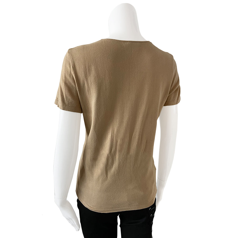 Chanel Tan color Short Sleeved Knit Top Interlocking with CC logo woven into fabric in front. Small repair to right shoulder, visually minimal while wearing. Short sleeves with round neck in fine rib knit of 100% cotton. Color: Tan Size: FR 44 Made in France