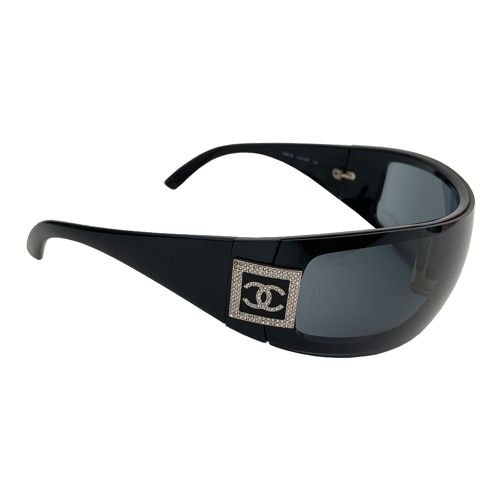 Chanel Crystal Wrap Logo Sunglasses, circa Mid 2000’s in excellent condition, no scratching on lenses. Wrap style frames and removable lenses with crystal logo at temples. Color: Black lens and frame. Style: 5086 Original box, case and cleaning cloth and cards included All in excellent condition