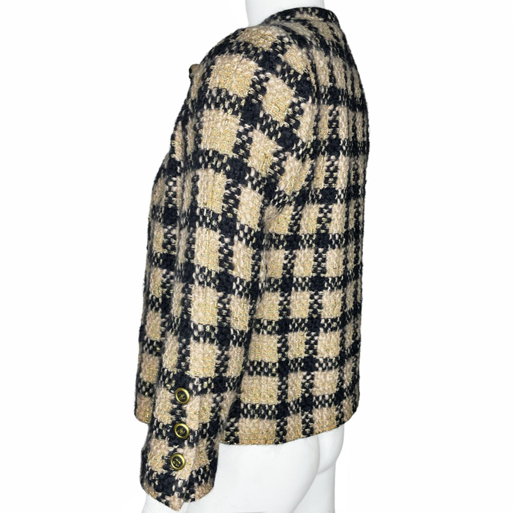 Chanel 1994 gold & black tweed jacket by Karl Lagerfeld for Chanel, autumn 1994 with wrist length sleeves, single snap button closure. Three Chanel CC gold & black buttons on each sleeve. Made in France