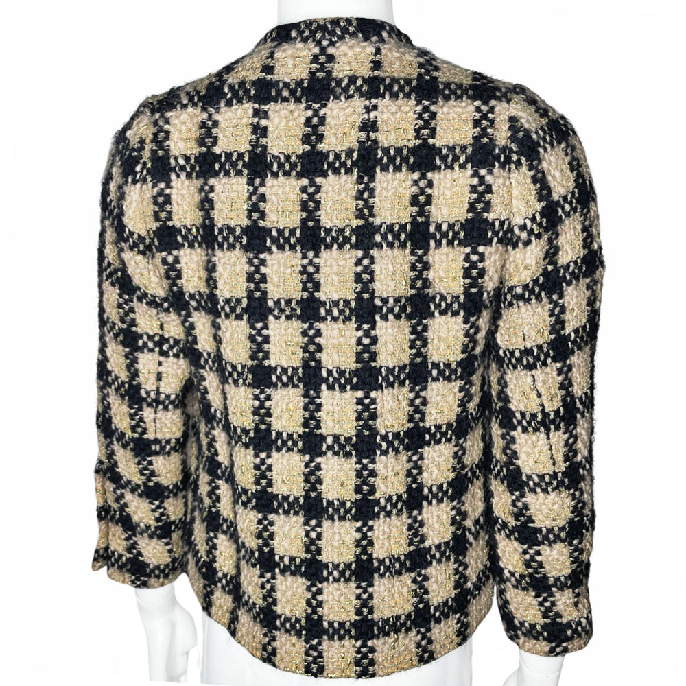 Chanel 1994 gold & black tweed jacket by Karl Lagerfeld for Chanel, autumn 1994 with wrist length sleeves, single snap button closure. Three Chanel CC gold & black buttons on each sleeve. Made in France