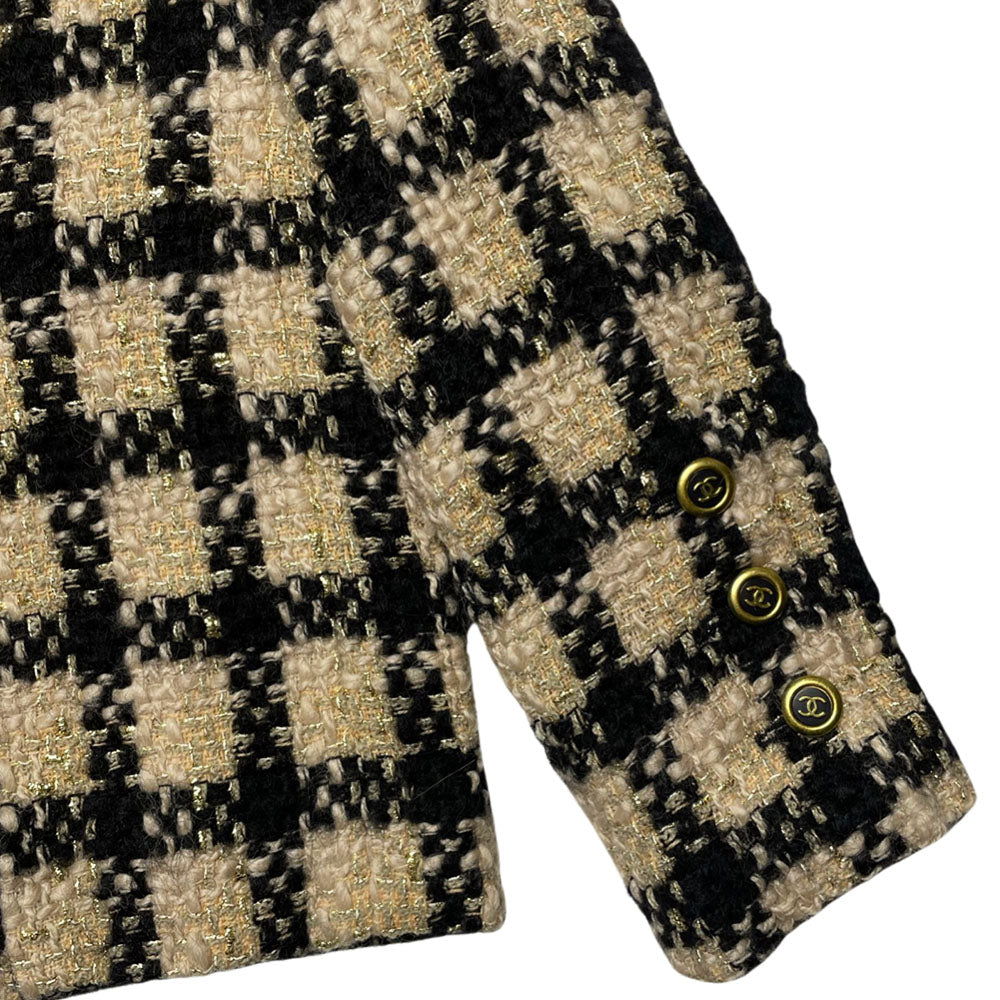 Chanel 1994 gold & black tweed jacket by Karl Lagerfeld for Chanel, autumn 1994 with wrist length sleeves, single snap button closure. Three Chanel CC gold & black buttons on each sleeve. Made in France