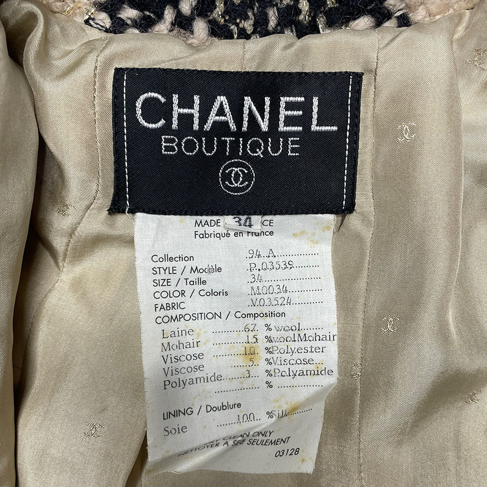 Chanel 1994 gold & black tweed jacket by Karl Lagerfeld for Chanel, autumn 1994 with wrist length sleeves, single snap button closure. Three Chanel CC gold & black buttons on each sleeve. Made in France