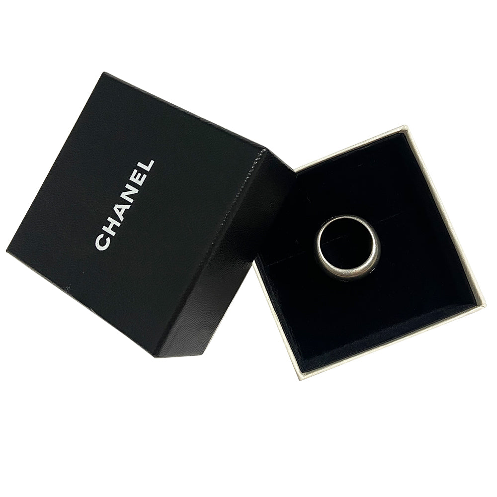 Chanel alphabet ring by Karl Lagerfeld for Chanel, spring 1997. Silver-tone thick band ring with Chanel floating engraved letters. Size: approx 6.5