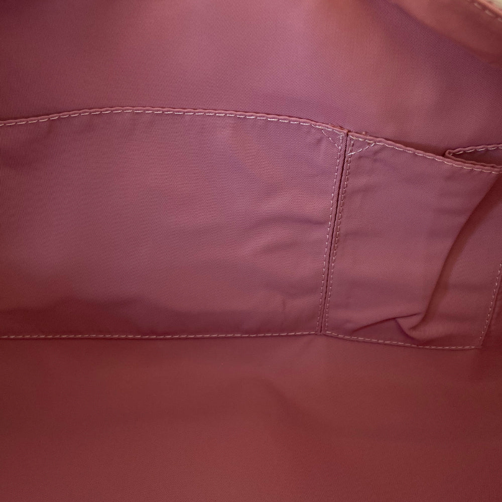 Christian Dior large pink monogram canvas boston by John Galliano for Dior, 2004 with white leather piping, cream patent leather accent trim, rolled handles and zipper pull, silver-tone hardware and feet. 2 exterior open pockets with leather accent, pink textile interior with one interior zip pocket, 2 slip pockets.