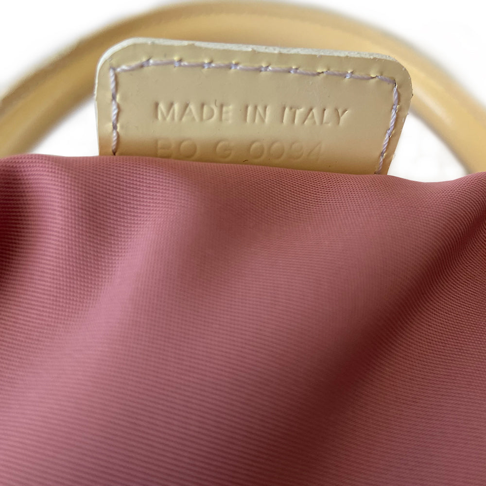 Christian Dior large pink monogram canvas boston by John Galliano for Dior, 2004 with white leather piping, cream patent leather accent trim, rolled handles and zipper pull, silver-tone hardware and feet. 2 exterior open pockets with leather accent, pink textile interior with one interior zip pocket, 2 slip pockets.