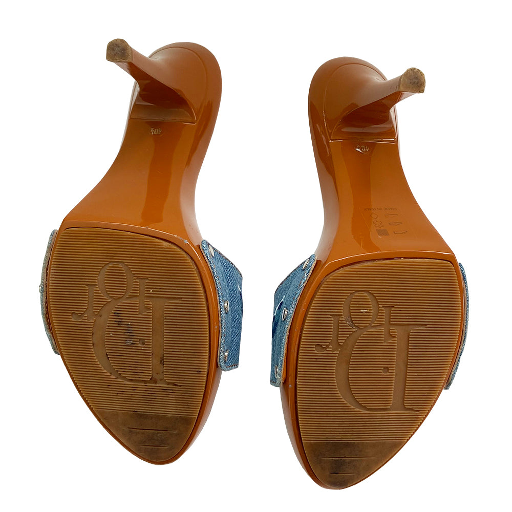 Christian Dior light denim open toe butterfly embroidered slide heels. Denim upper with embroidered butterfly on each shoe in 3 shades of blue, high gloss caramel color platform and soles with embossed rubber grips. Silver-tone logo initial on each shoe, with silver-tone stud attachments at sides. Made in Italy