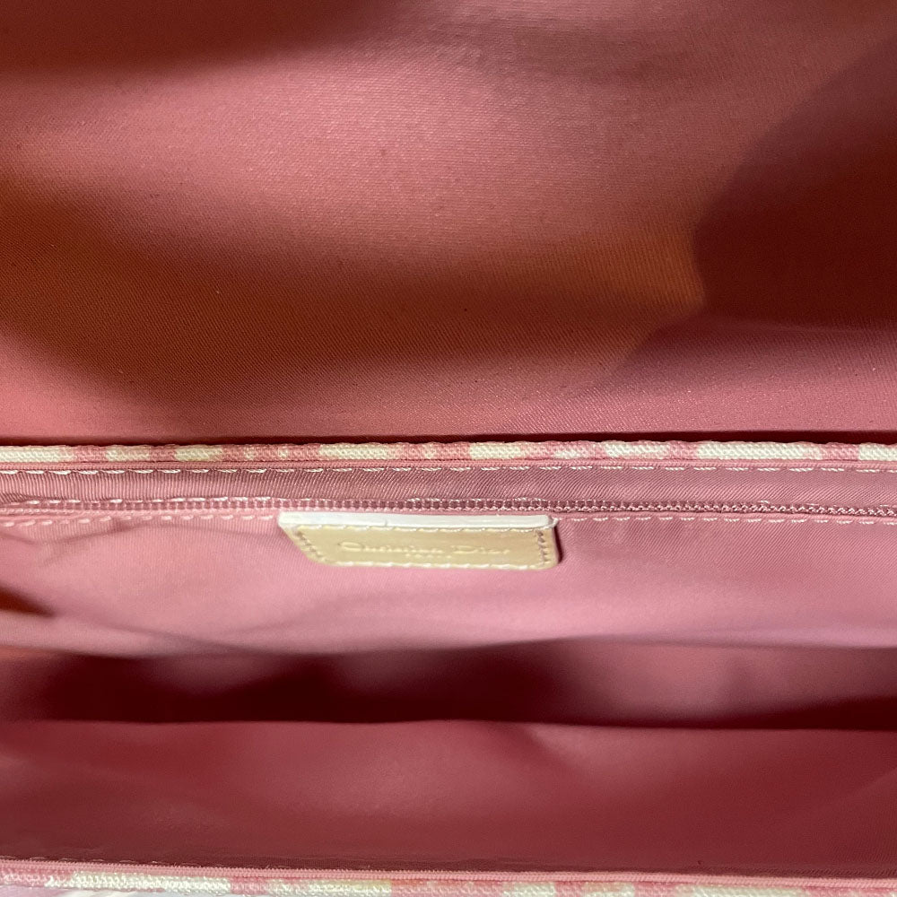 Christian Dior pink monogram canvas girly flap bag by John Galliano for Dior 2004 with pearl center white flowers, white patent piping, Swarovski crystal No 1 and Dior crystal logo. Pink with white edged satin canvas adjustable shoulder strap. Pink textile interior, one interior pocket. Made in Italy