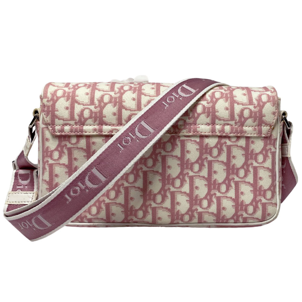Christian Dior pink monogram canvas girly flap bag by John Galliano for Dior 2004 with pearl center white flowers, white patent piping, Swarovski crystal No 1 and Dior crystal logo. Pink with white edged satin canvas adjustable shoulder strap. Pink textile interior, one interior pocket. Made in Italy