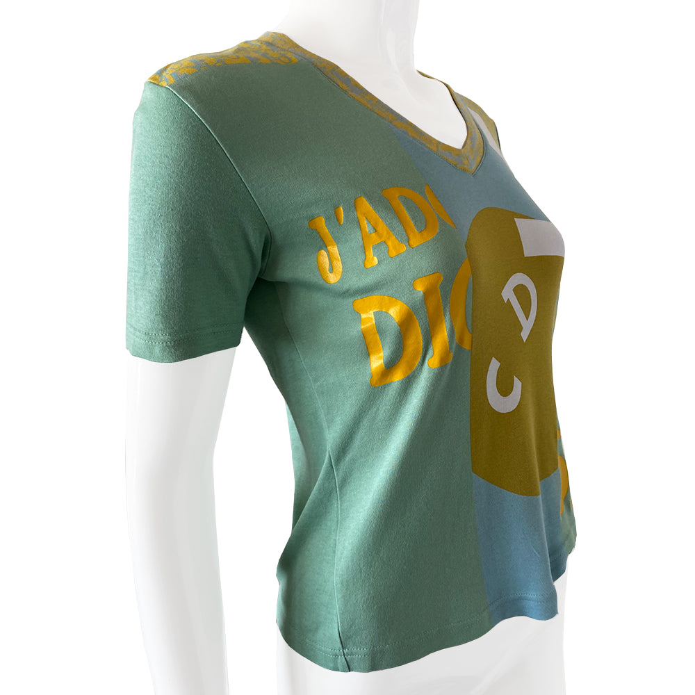 Christian Dior J’Adore Dior short sleeve V neck spring 2005 runway patchwork tee from Japan featuring a patchwork of iconic John Galliano for Dior logo designs through the years Fabric: 100% cotton. Color: Main: Turquoise and blue Fabric: 100% cotton Size: FR 38 Made in Portugal
