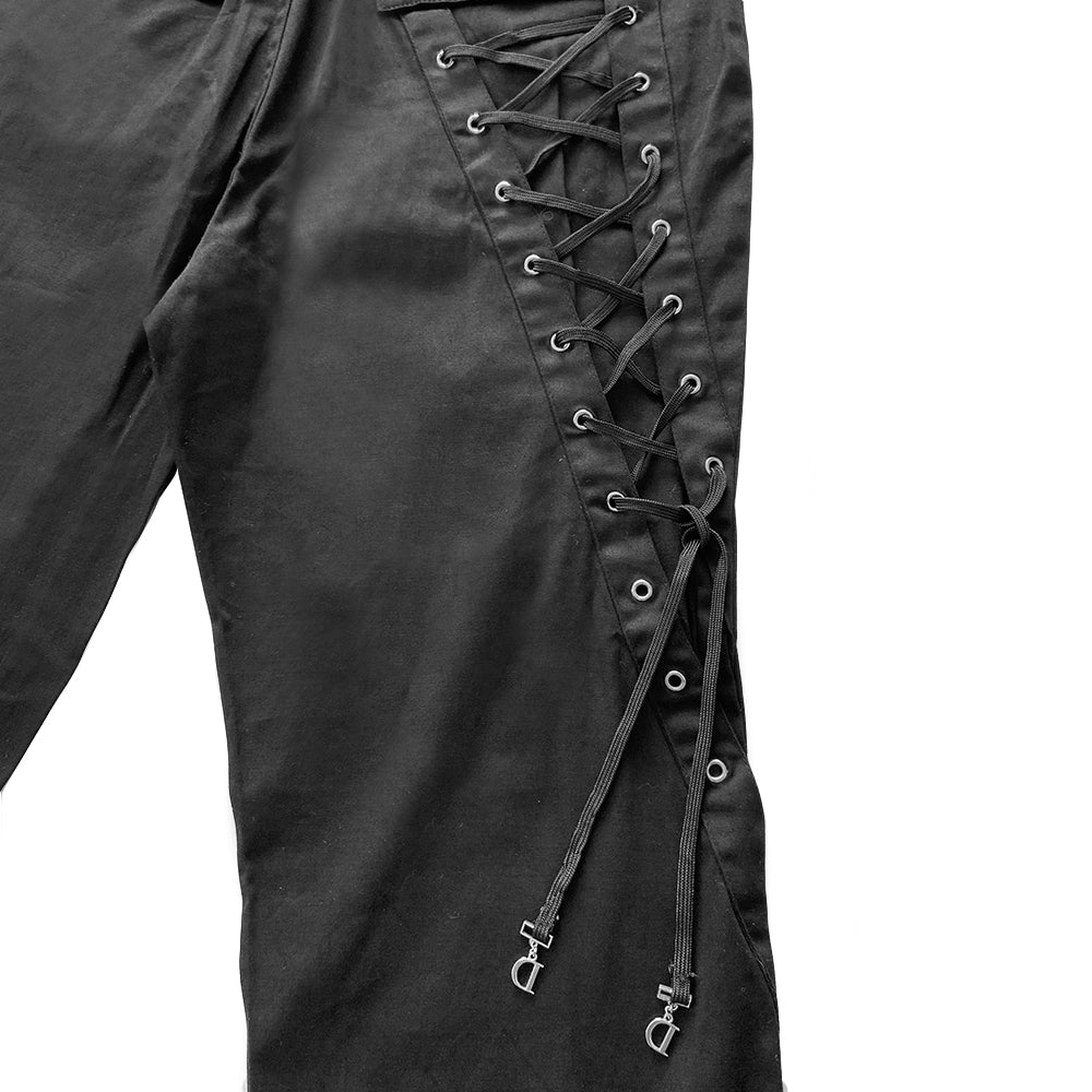 Christian Dior Lace Up Trousers from autumn 2013, high waisted with belt loops, flared leg with silver-tone hardware, grommets and logo buttons. Crystal Dior logo at front pocket opening and leather flower and number 1 surrounded with crystals at hemline 2 back snap pockets. Laces with metal logo D’s through metal grommets