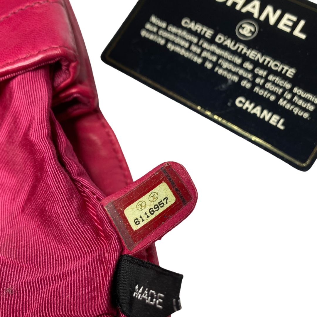 Chanel fuchsia choco quilt soft lamb double body flap bag with silver-tone metal ball chain strap and pink transluscent lucite baubles by Karl Lagerfeld for Chanel, 2000. Front bauble clasp closure with embedded silver-tone CC logo opens to dual partitioned compartments lined in tonal grosgrain, one interior zip pocket. Made in Italy