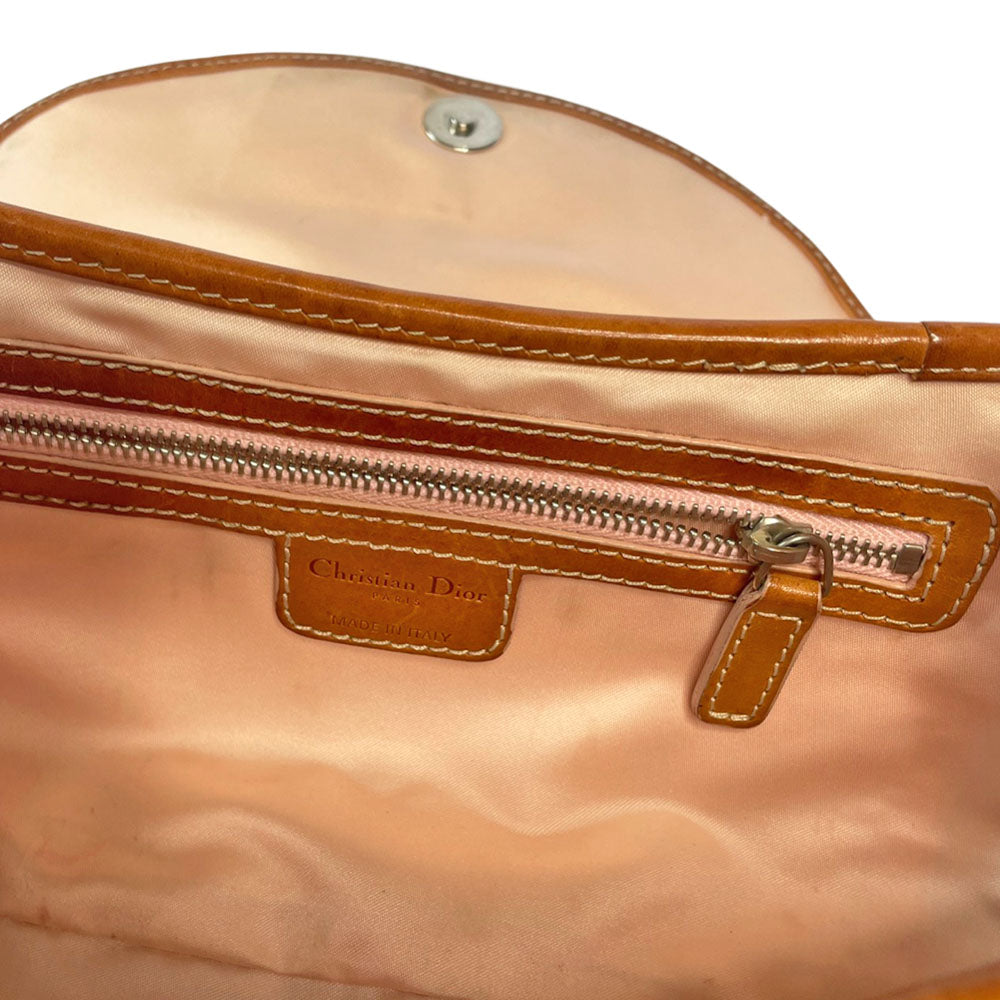 Christian Dior beige monogram coated canvas small shoulder bag by John Galliano for Dior, 2007 with brown leather piping, magnetic front flap, brown leather & pink leather bow detail with Dior logo embossed pink leather covered hanging heart. Blush rose satin lining, one zipper pocket. Pink leather woven through silver tone chain with brown leather strap. Made in Italy
