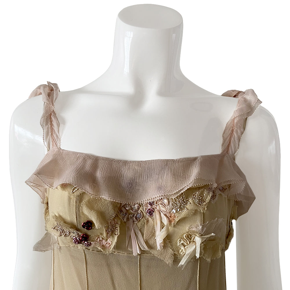 Louis Vuitton x Marc Jacobs S/S 2004 Picot ruffled 100% silk chiffon dress with 22 small covered buttons at back. Small metallic lilac and red jewel-tone roses, pink ribbons, lilac embroidery and opalescent sequins on frayed chiffon at bodice. Pink chiffon ruffle border at top. Multi cream chiffon at straps. Separate under-slip included. Dress and slip professionally cleaned. Slip has minor stain. Dress has very few minor stains, not visible when wearing.