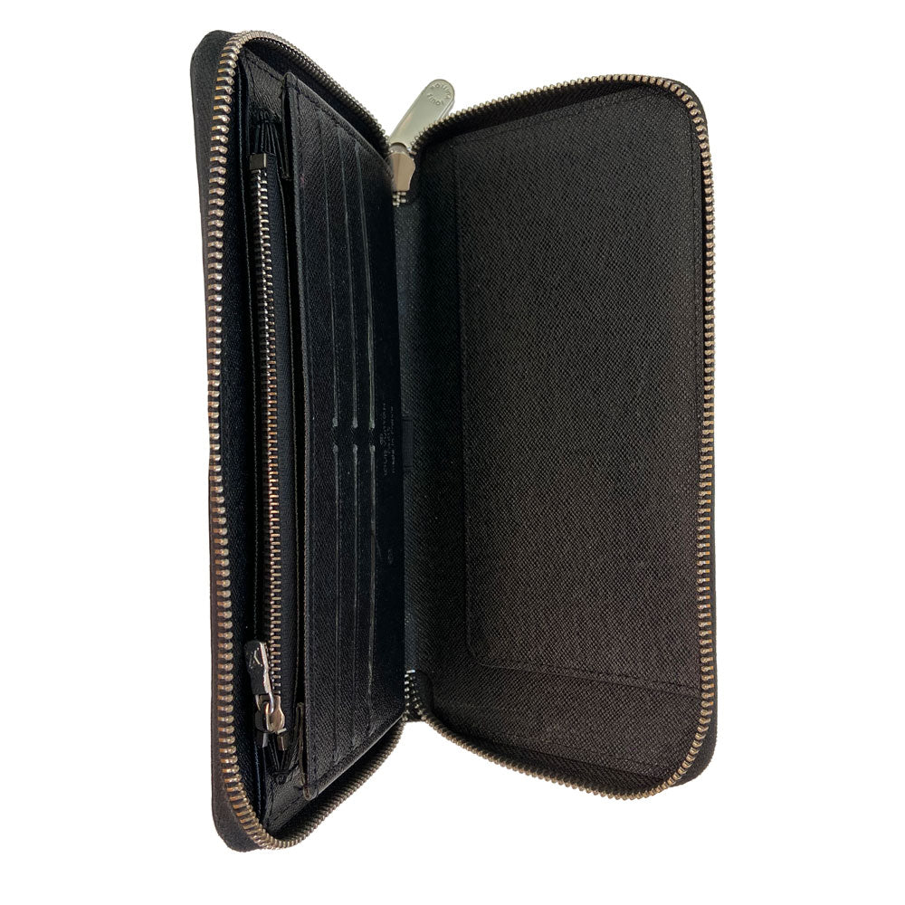 Louis Vuitton black epic Zippy Wallet from 2013. Silver-tone zipper and hardware 3 sided outer zipper with bill pocket, zipped coin pocket, 12 card slots, 3 open compartments with 1 bill slot. LV exterior heat stamp, engraved zipper pulls. Interior date code visible. Made in France 