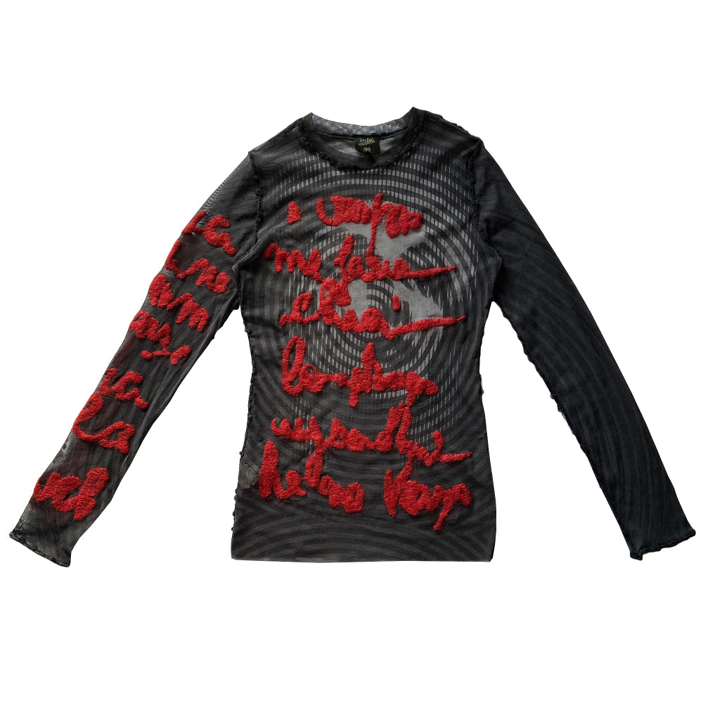 Jean Paul Gaultier Femme rare optical illusion long sleeve mesh top, AW 2001 featuring classic film icon Marlene Dietrich on front and back with red mohair front embroidered script writing and along one sleeve, black boucle accent trim on seams and neckline. Tag size: 40. Made in Japan