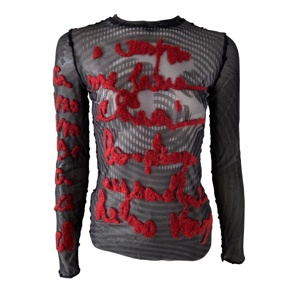 Jean Paul Gaultier Femme rare optical illusion long sleeve mesh top, AW 2001 featuring classic film icon Marlene Dietrich on front and back with red mohair front embroidered script writing and along one sleeve, black boucle accent trim on seams and neckline. Tag size: 40. Made in Japan