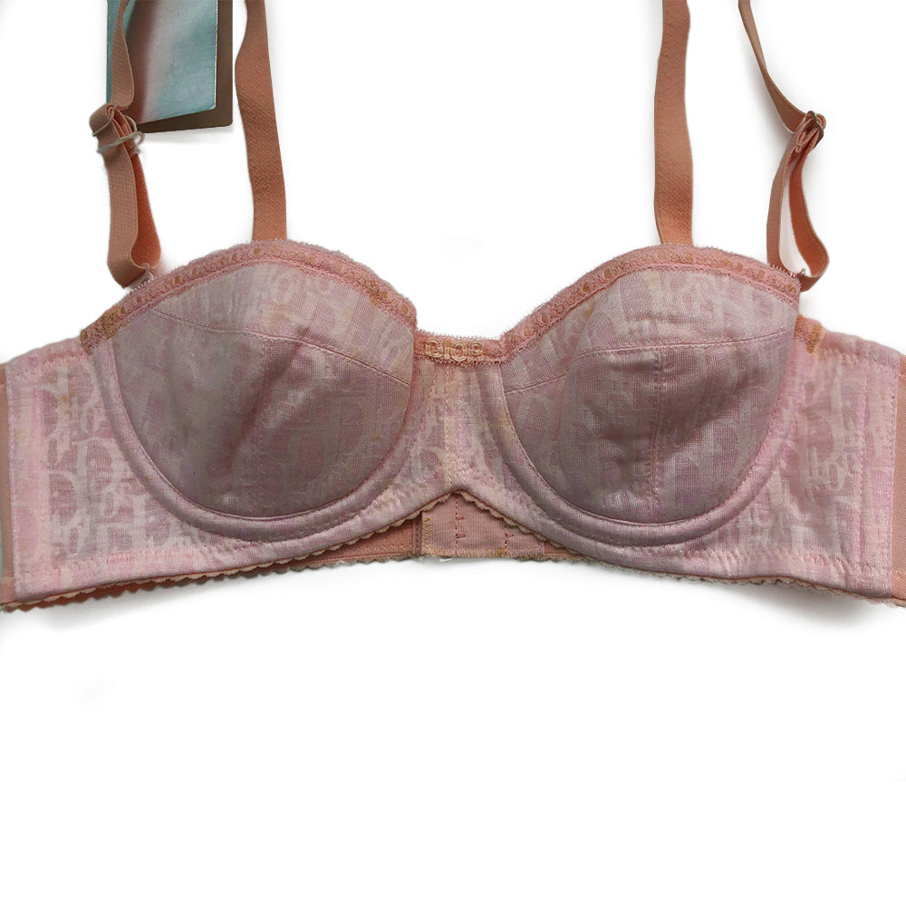 Christian Dior Monogram Trotter Pink Bra from Christian Dior Lingerie. Japanese Size: A70 All over monogram Trotter monogram pattern in pink on pink. Stretch satin adjustable straps with 3 hook closure Lace accent trim with delicate lace “Dior" in center.