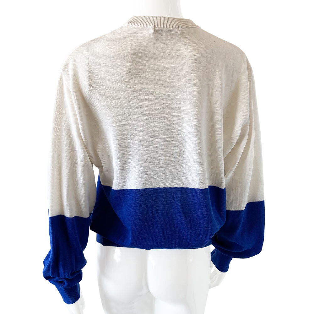 Christian Dior CD Sports Sweater circa 1980’s 1990’s crew neck color block sweater with intarsia knit CD Logo and embellished with embroidered letters with ribbing at neck, sleeve and bottom hem in blue/white with yellow Size Large. Good condition, consistent with age.