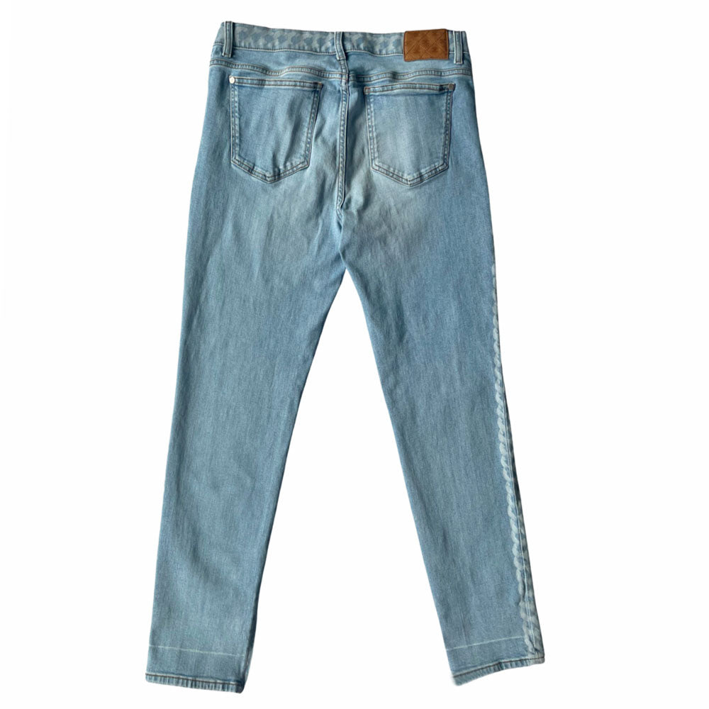 Chanel 2019 mid rise skinny faded wash 5 pocket stretch denim pants with faded white chain link design at waistband and down outer legs, CC engraved logo silver-tone rivets and top button, 5 " CC logo ankle zippers. Belt loops at waistband, calfskin leather diamond stitched CC logo patch at waistband. Made in Italy