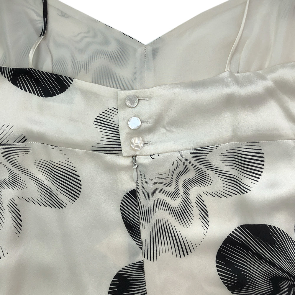 Chanel cream with printed black camellia flowers and interlocking CC design silk slip dress.