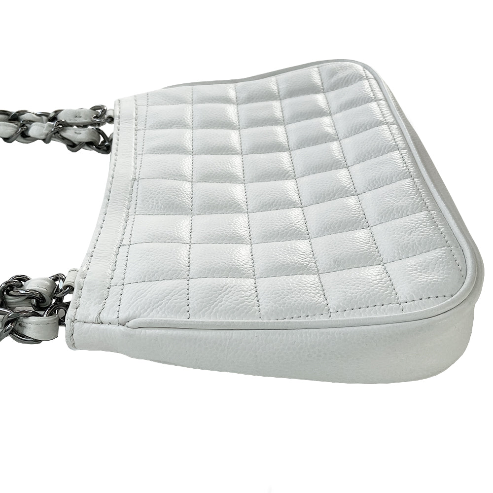 White Chanel Button Chain Quilted Shoulder Bag with 2 Gunmetal front buttons and 2 gunmetal chain link and interwoven leather straps, exterior quilted front pocket. Magnetic snap button closure, burgundy textile jacquard Chanel lining. Chanel Paris engraved on inside clasp. Interior hologram date code tag attached.