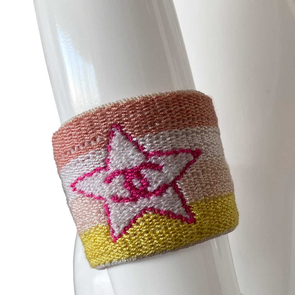 Chanel Sport heart and star sweatband wristband by Karl Lagerfeld for Chanel, cruise collection 2004 cruise. 4 color pastel striped elasticized terry knit sport wristband featuring fuchsia CC logo heart and star Color: Peach, white, pastel pink, yellow stripes, fuchsia heart and star logo