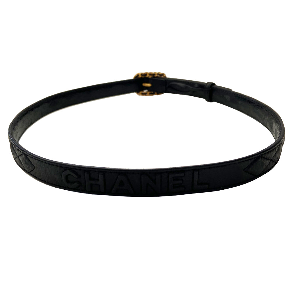 Chanel quilted lamb leather logo gold chain buckle belt by Karl Lagerfeld for Chanel, Autumn 1992. Diamond quilting with CHANEL letters embossing on belt leather and intertwined leather through gold-tone chain buckle closure. Adjustable sizing with 3 hole adjustment. Made in France