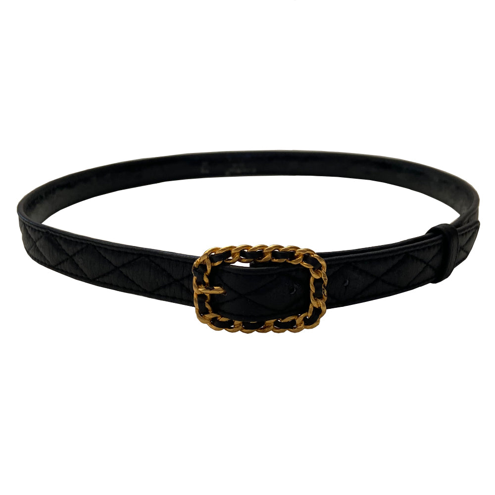 Chanel quilted lamb leather logo gold chain buckle belt by Karl Lagerfeld for Chanel, Autumn 1992. Diamond quilting with CHANEL letters embossing on belt leather and intertwined leather through gold-tone chain buckle closure. Adjustable sizing with 3 hole adjustment. Made in France