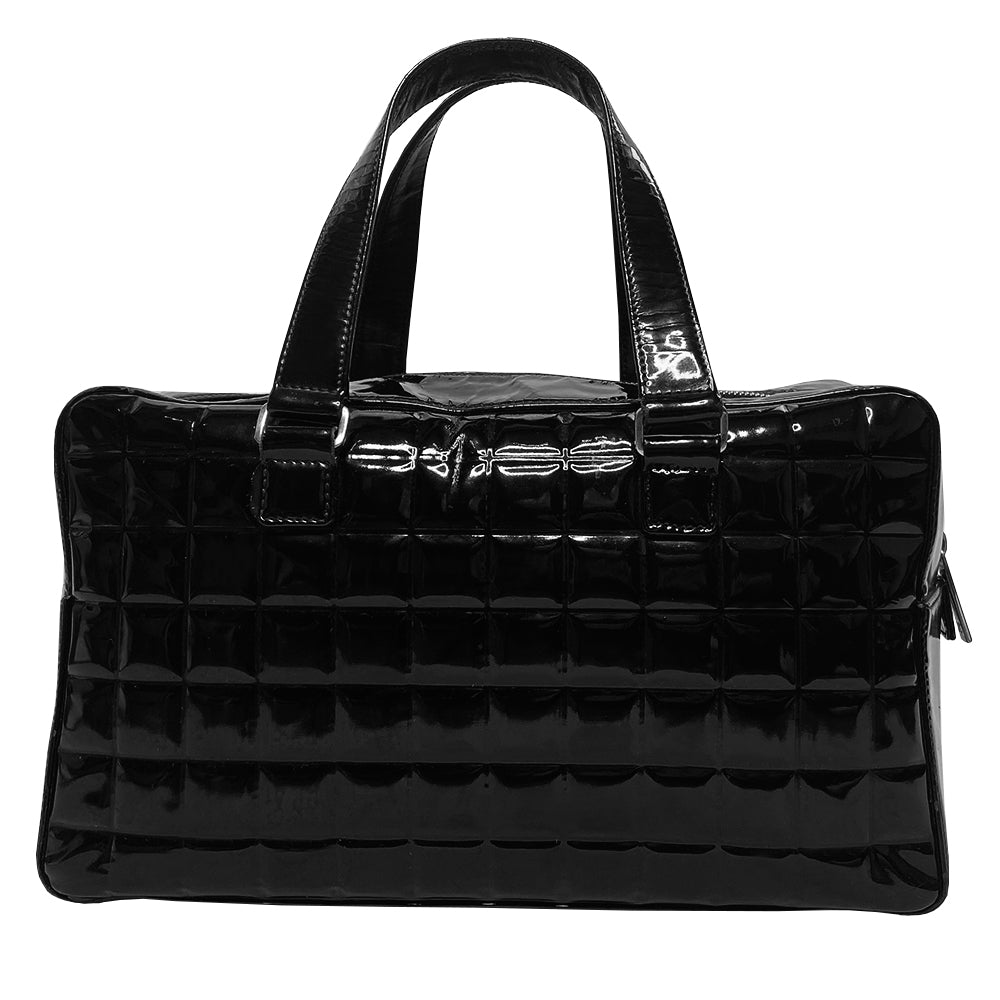 Chanel Chocolate Bar black patent leather quilted rectangular bowler tote by Karl Lagerfeld for Chanel 2003 with prominent interlocking CC front logo and 2 flat top handles, silver-tone hardware and feet. Dual Chanel engraved zipper closure with red microfiber lining and one zip pocket. Made in Italy