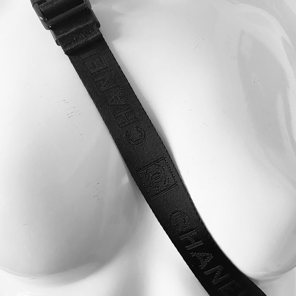 Chanel Sport canvas CC logo draw string water bottle holder by Karl Lagerfeld for Chanel, sport collection 2004. White and black nylon fabric with side zipper and CHANEL nylon webbing, adjustable long strap with sport clip closure. Box CC rubber front logo, black textile interior, date code tag attached. Made in Italy