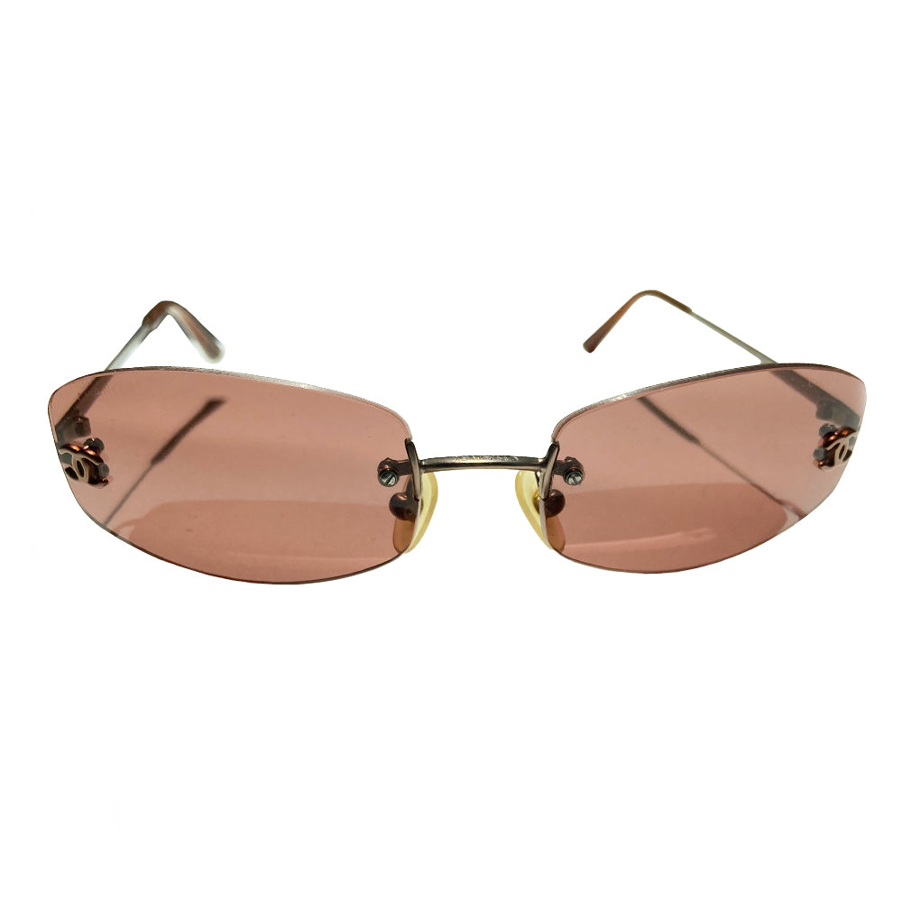 Chanel frameless brown oval lens CC logo sunglasses and silver-tone CC logo on each lens. Silver-tone metal arms with CC logo at the end of each arm. Style: 4002 c116/75 with case. No scratches on glasses, case in good condition Made in Italy