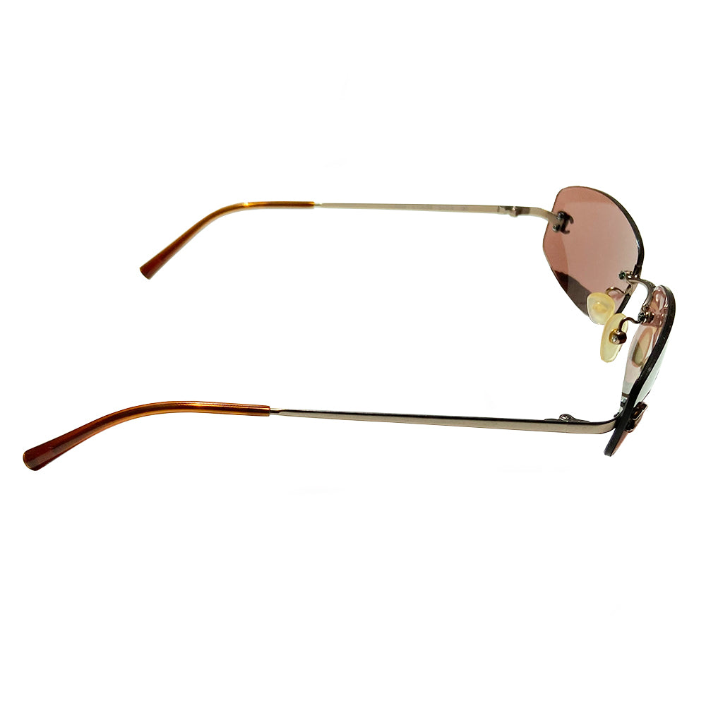 Chanel frameless brown oval lens CC logo sunglasses and silver-tone CC logo on each lens. Silver-tone metal arms with CC logo at the end of each arm. Style: 4002 c116/75 with case. No scratches on glasses, case in good condition Made in Italy