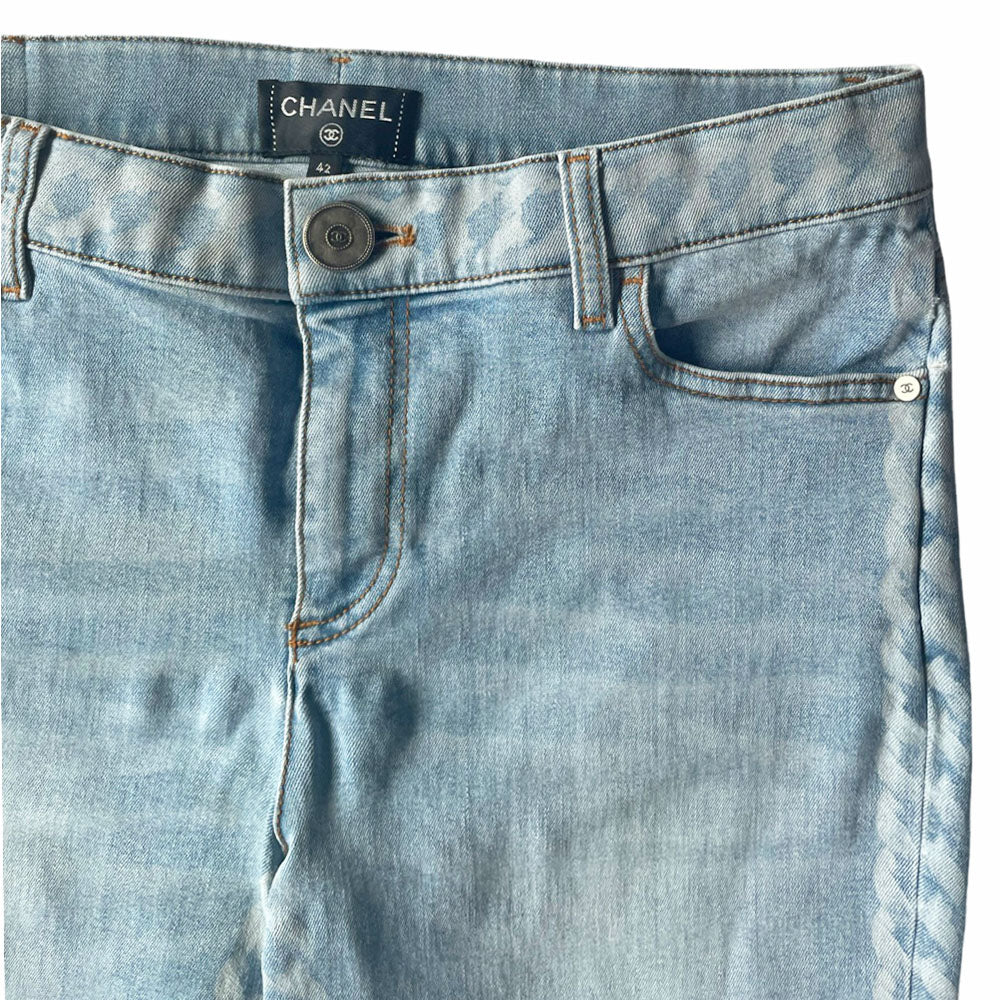 Chanel 2019 mid rise skinny faded wash 5 pocket stretch denim pants with faded white chain link design at waistband and down outer legs, CC engraved logo silver-tone rivets and top button, 5 " CC logo ankle zippers. Belt loops at waistband, calfskin leather diamond stitched CC logo patch at waistband. Made in Italy