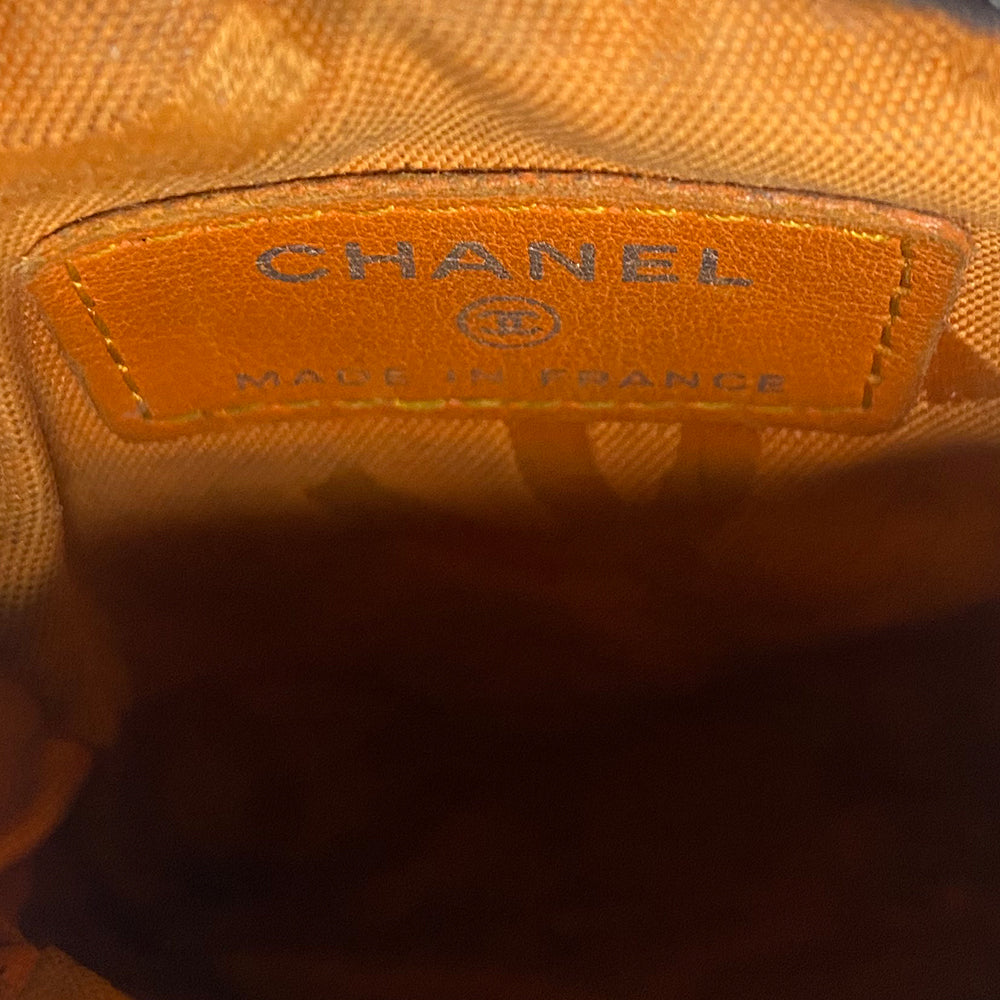 Chanel Cambon quilted brown leather cigarette case by Karl Lagerfeld for Chanel, circa 2004-2005 with outer slip pocket, tonal interlocking CC logo stitched appliqué. Rear leather belt loop, top zip closure with silver-tone metal logo engraved chain zipper pull. Orange CC logo textile lining Interior. Made in France