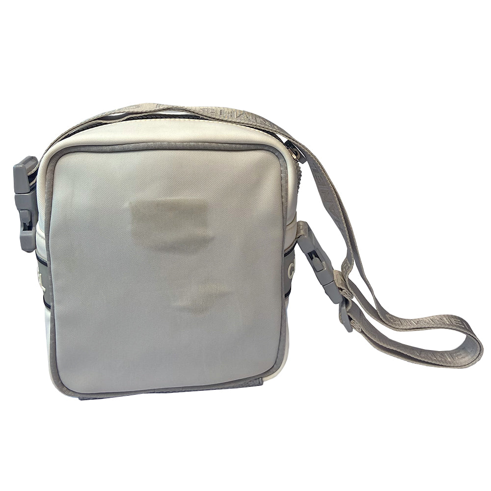 Chanel grey with silver Sport Line nylon canvas rectangular cross body messenger bag by Karl Lagerfeld for Chanel, 2001 with angled box front CC logo, rubber CHANEL side logos, grey piping and long sating webbing logo removable shoulder strap. Top ziper with grey textile interior and inside slip pocket. Made in Italy