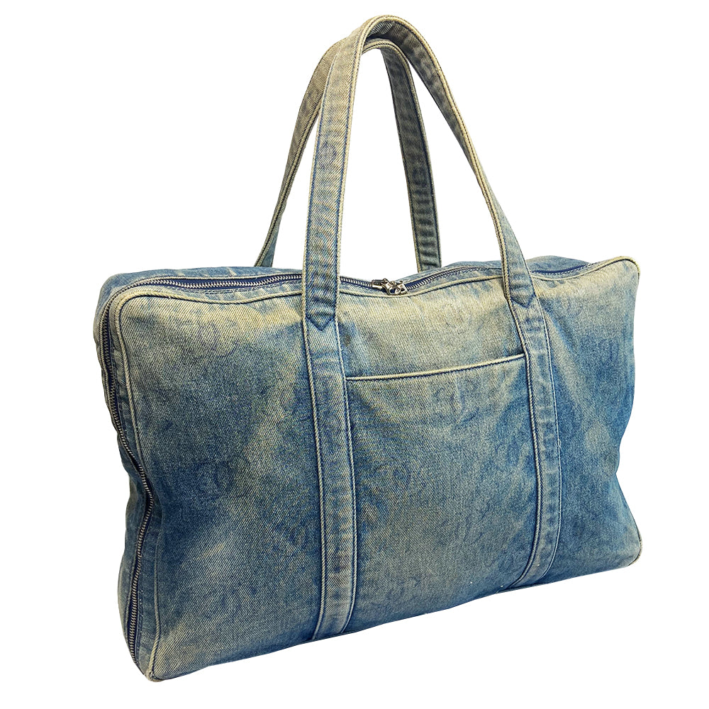 Chanel all over CC logo distressed denim overnight bag by Karl Lagerfeld for Chanel 2003 with detachable key pouch, outer slip pocket, dual zip closure, double carry handles. Jacquard textile CC logo print lining with zippered pocket, elastic compression straps to hold items in place. Serial number sticker attached.