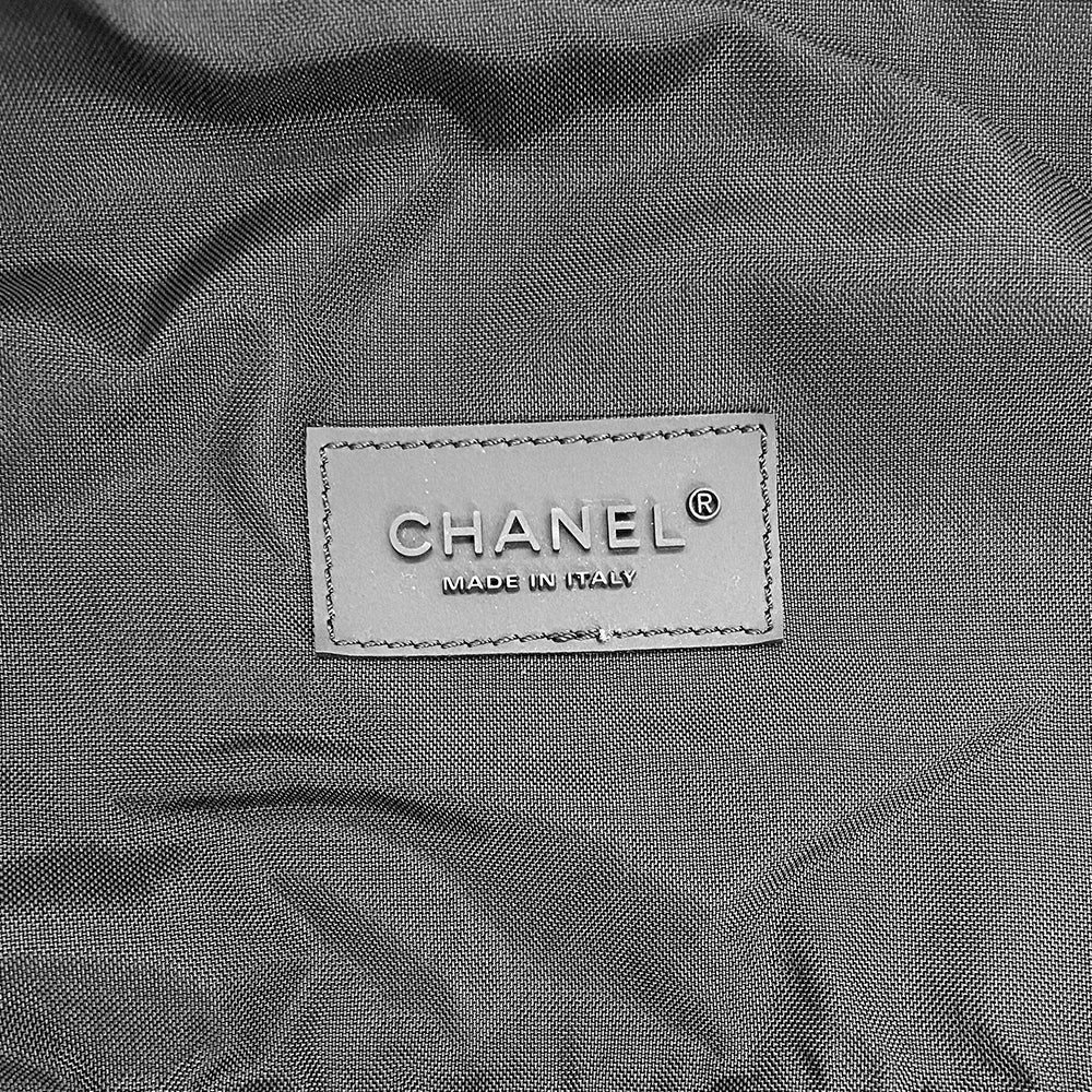 Chanel sport canvas and mesh large grey/black/cream duffle bag by Karl Lagerfeld for Chanel, 2003/2004 zipper closure and boxed rubber CC front logo, 2 exterior end pockets and one exterior front pocket. Double Chanel embossed satin webbing logo carry straps. Serial number sticker attached. Made in Italy