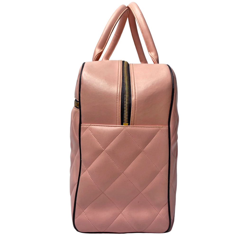 Chanel pink diamond quilted leather boston bag by Karl Lagerfeld for Chanel 1995 with contrasting black leather piping, trim and stitched CHANEL letters front logo. Gold tone zippers and feet, exterior zip pocket, top zipper closure, lack leather interior with one interior zip pocket. Made in France