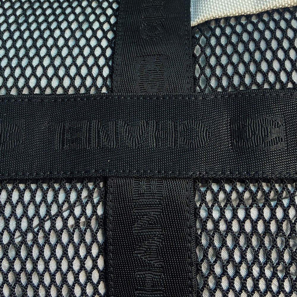 Chanel sport canvas and mesh large grey/black/cream duffle bag by Karl Lagerfeld for Chanel, 2003/2004 zipper closure and boxed rubber CC front logo, 2 exterior end pockets and one exterior front pocket. Double Chanel embossed satin webbing logo carry straps. Serial number sticker attached. Made in Italy