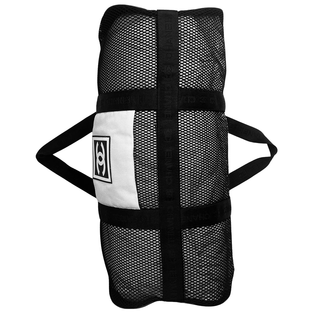 Chanel sport canvas and mesh large grey/black/cream duffle bag by Karl Lagerfeld for Chanel, 2003/2004 zipper closure and boxed rubber CC front logo, 2 exterior end pockets and one exterior front pocket. Double Chanel embossed satin webbing logo carry straps. Serial number sticker attached. Made in Italy