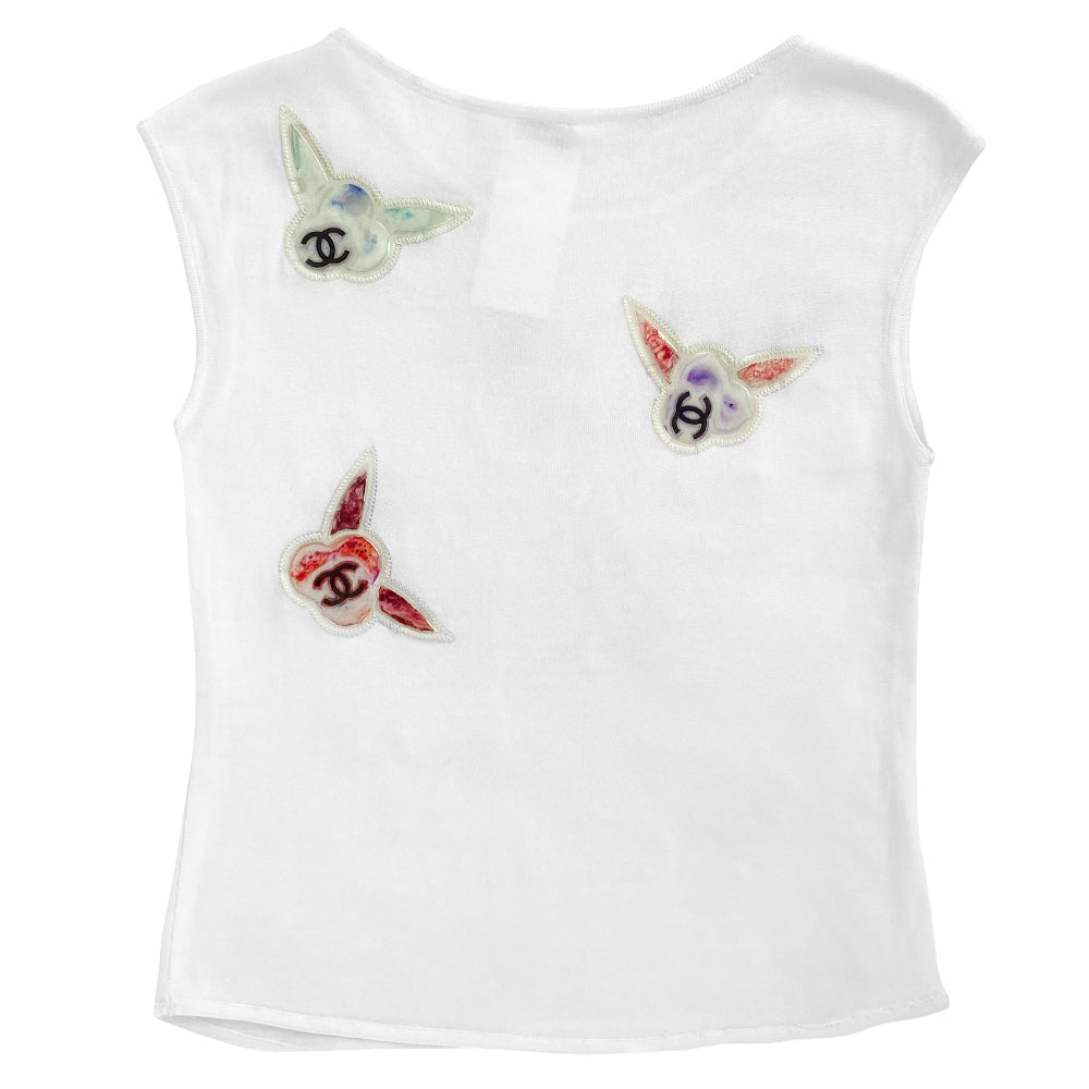 Chanel sleeveless white knit top by Karl Lagerfeld for Chanel 1997 embellished with CC logo colorful vinyl appliqué camellia flowers at front and back. Tag size: 36. Made in France