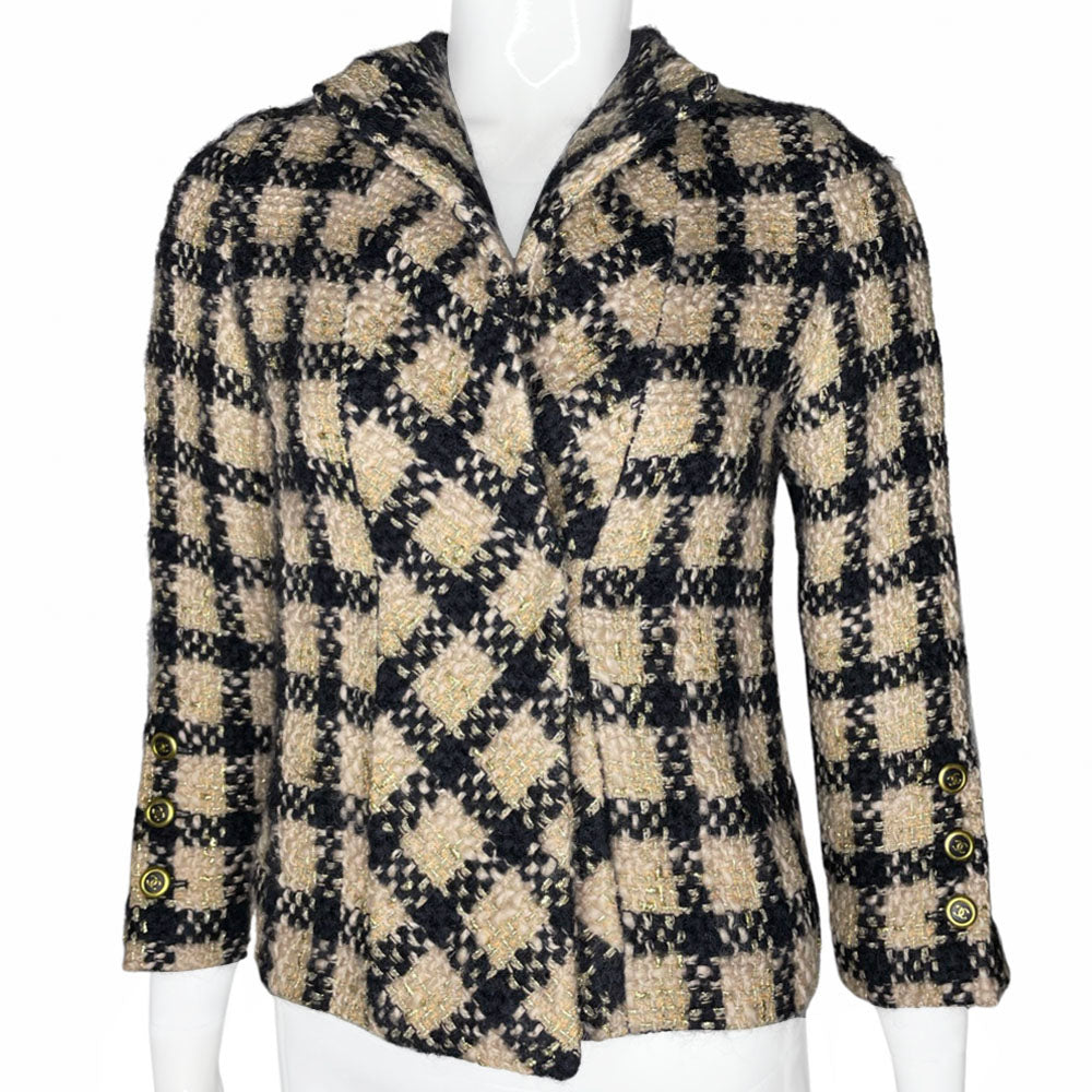 Chanel 1994 gold & black tweed jacket by Karl Lagerfeld for Chanel, autumn 1994 with wrist length sleeves, single snap button closure. Three Chanel CC gold & black buttons on each sleeve. Made in France
