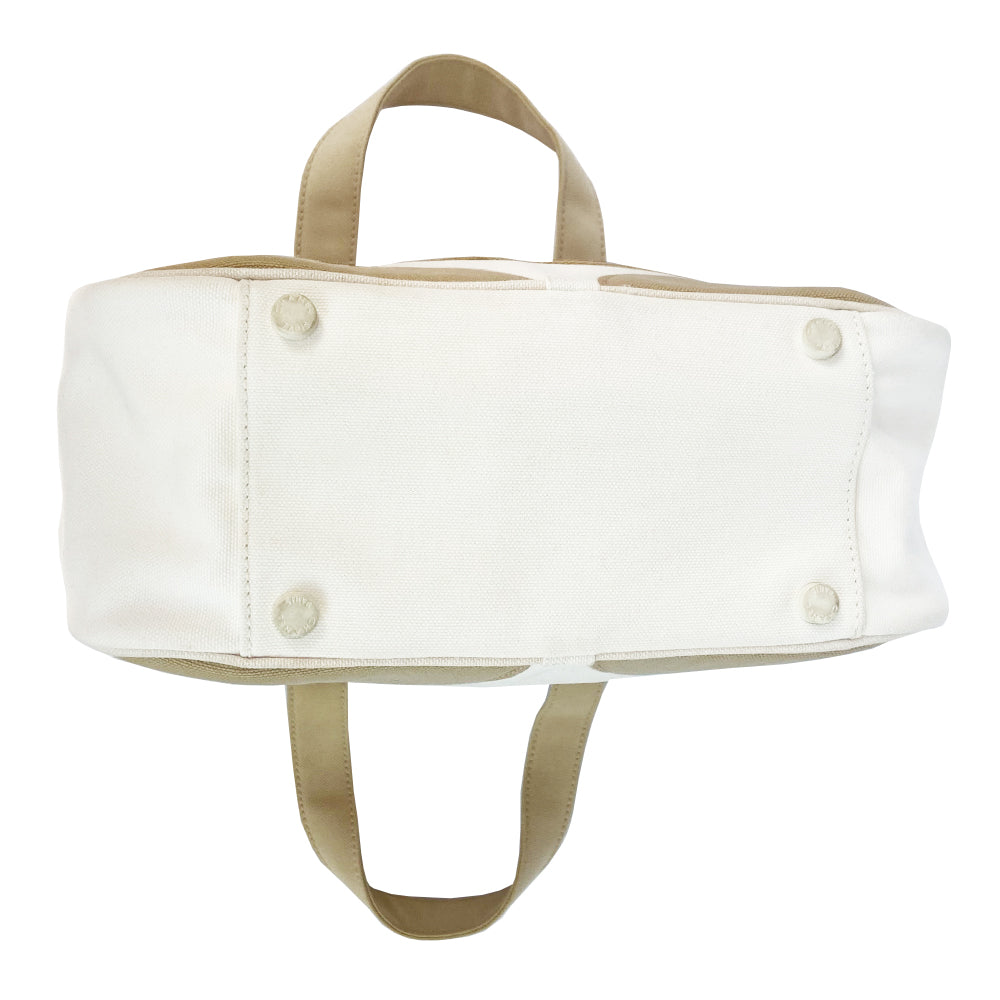 Chanel canvas Marshmallow Tote by Karl Lagerfeld for Chanel 2003-2004. White canvas tote with taupe handles and accent, stitched interlocking CC front logo, protective bottom feet. Gold-tone top zipper and hardware Chanel printed textile interior with one interior zip pocket. Made in Italy