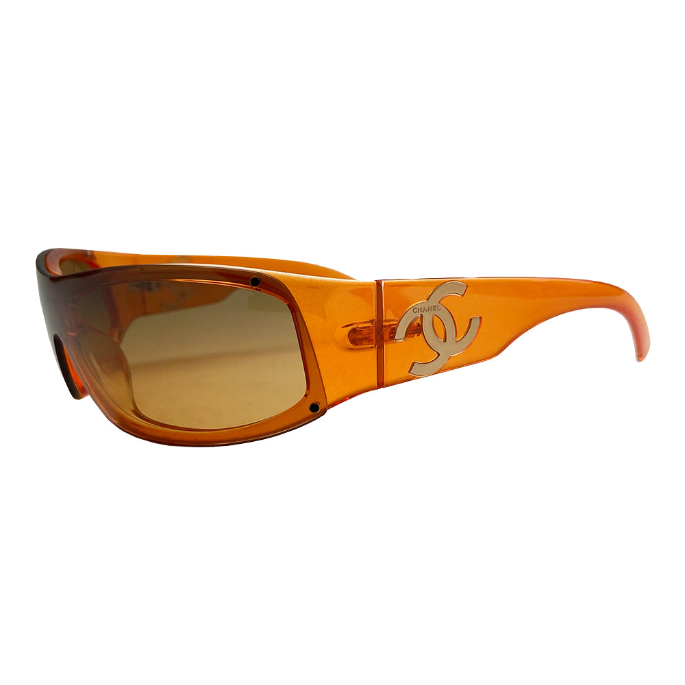 Chanel Translucent Orange Frame CC Logo Sunglasses. Curved rectangular acetate frame with prominent CC gold-tone logo at each arm. Brown gradient lens Style: 5072 Hard case included Excellent condition, very minimal scratches on lens, case in good condition Made in Italy
