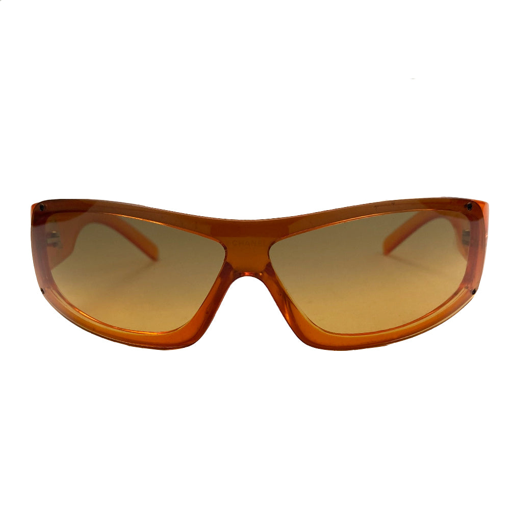 Chanel Translucent Orange Frame CC Logo Sunglasses. Curved rectangular acetate frame with prominent CC gold-tone logo at each arm. Brown gradient lens Style: 5072 Hard case included Excellent condition, very minimal scratches on lens, case in good condition Made in Italy