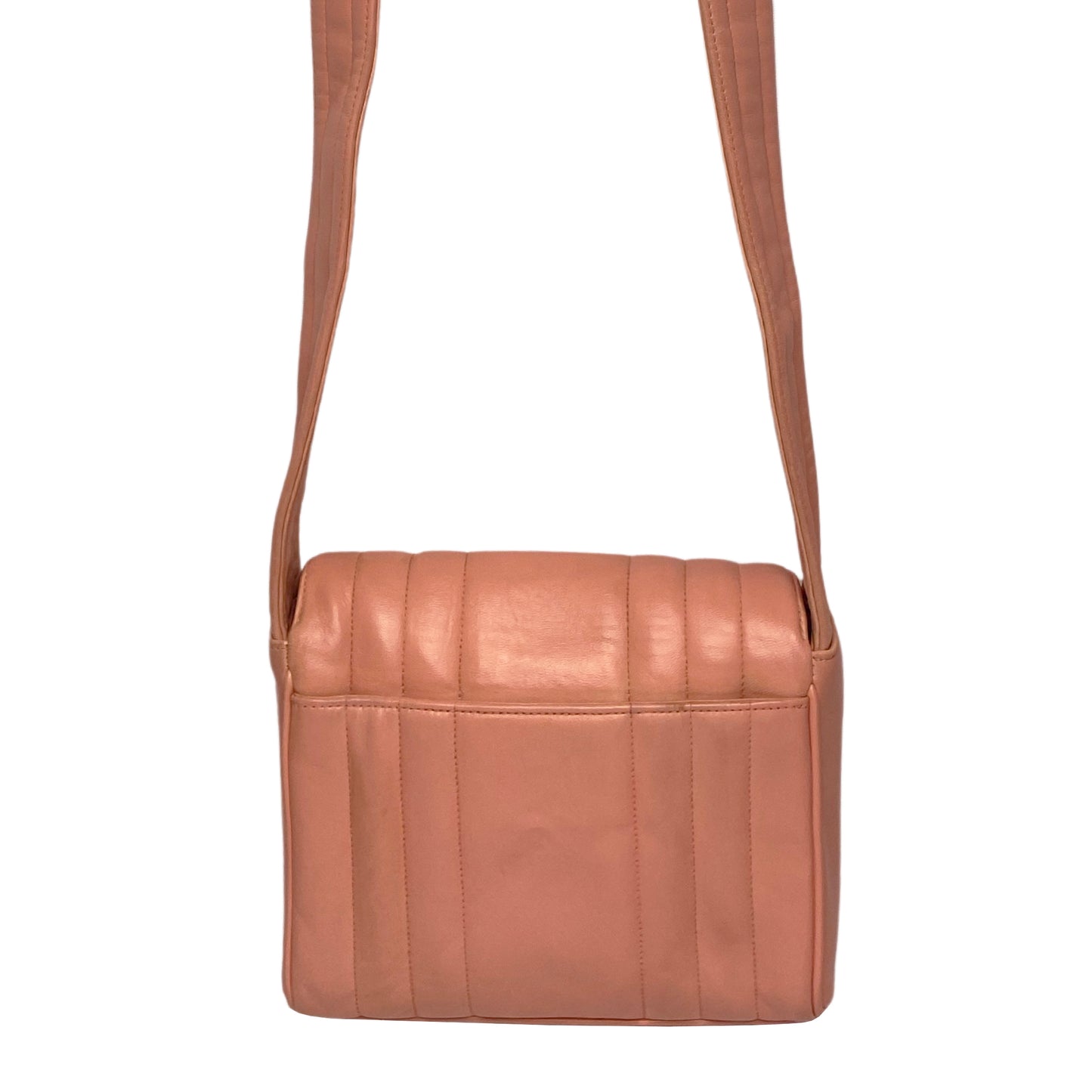 Chanel pink vertical quilt lamb leather bag by Karl Lagerfeld for Chanel, 1995 with envelope magnetic flap closure, interlocking CC raised leather front logo, rear outer slip pocket, long vertical quilted leather shoulder strap. Matching pink leather lining, slip pocket and grosgrain lined zippered pocket with gold medallion zipper pull. Made in France