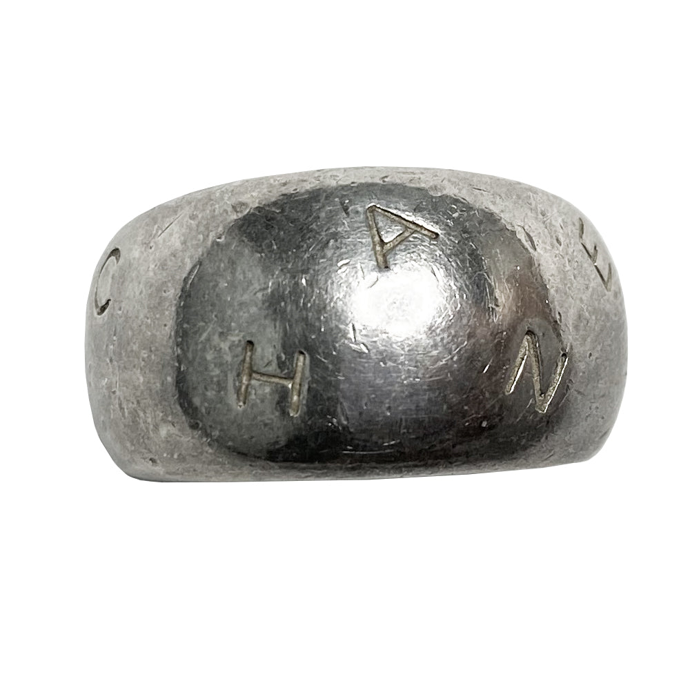 Chanel alphabet ring by Karl Lagerfeld for Chanel, spring 1997. Silver-tone thick band ring with Chanel floating engraved letters. Size: approx 6.5