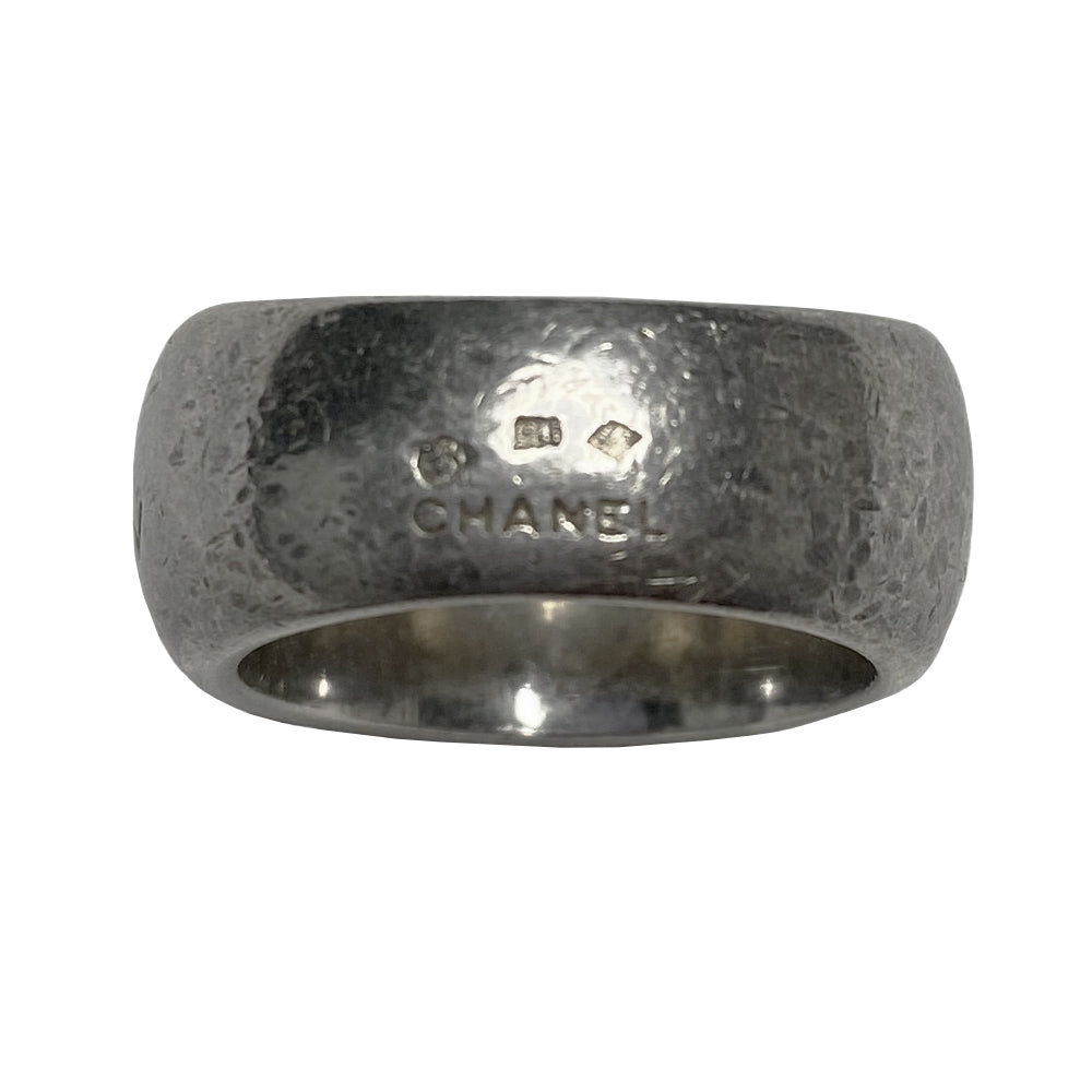 Chanel alphabet ring by Karl Lagerfeld for Chanel, spring 1997. Silver-tone thick band ring with Chanel floating engraved letters. Size: approx 6.5