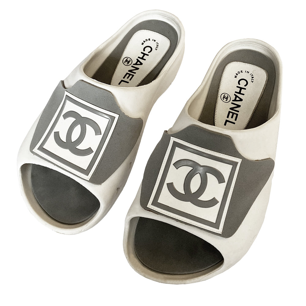 Chanel Sports Line white and grey rubber slides by Karl Lagerfeld for Chanel, spring 2001 RTW runway with embossed boxed CC silver logo upper and side air holes, grey insole with interior, Chanel logo at heel, white rubber tread sole with Chanel logo. Size: 37 Made in Italy