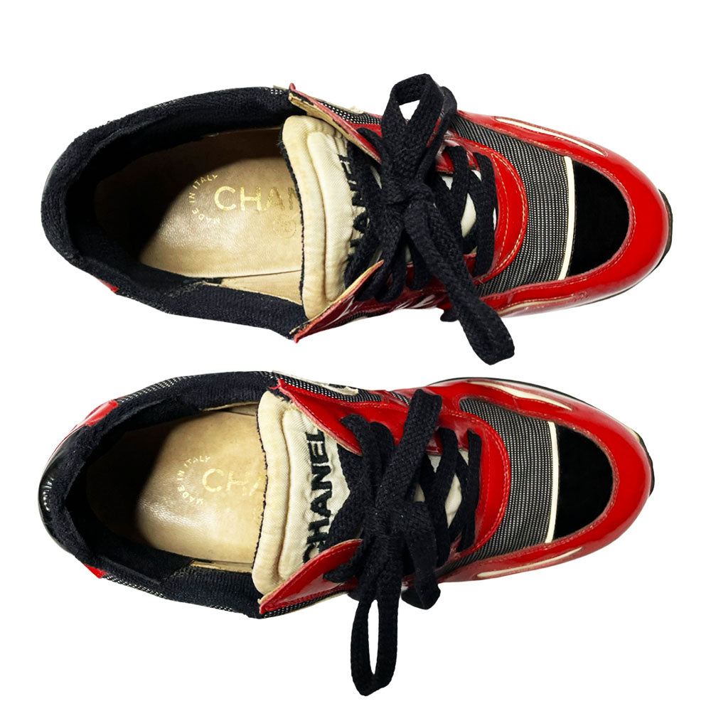 Chanel red with white patent block heel platform lace up sneakers by Karl Lagerfeld for Chanel, SS 1997 runway with nylon fabric inserts and tongue with CHANEL logo, white leather CC stitched logos on either side. Black rubber platform with white stripe & black with white stripe stacked rubber block heel, Chanel logo treaded sole. Made in Italy